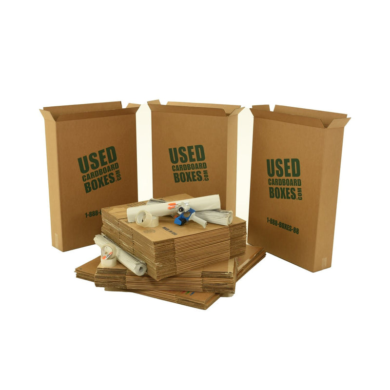 Various sizes of used moving and storage boxes shown flattened, along with included supplies, in a 2 Bedroom Moving Kit by UsedCardboardBoxes.