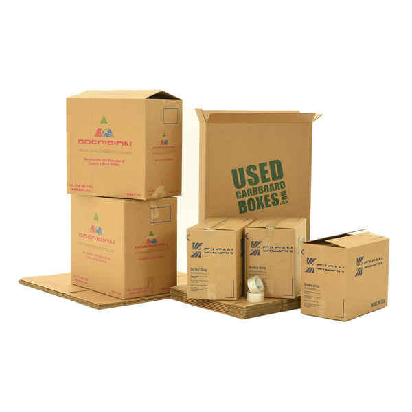 Various sizes of used moving and storage boxes shown assembled and flattened, along with included tape rolls, in a Pack Rat Moving Kit by UsedCardboardBoxes.