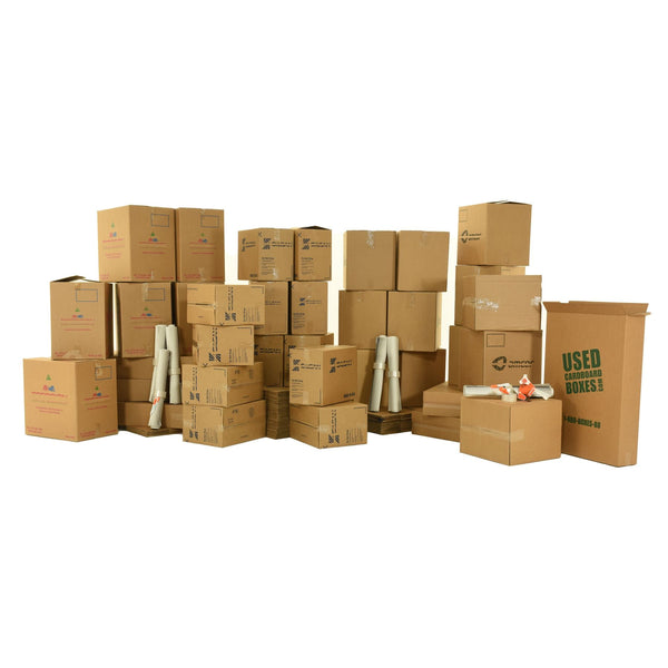 Various sizes of used moving and storage boxes shown assembled and flattened, along with included supplies, in a 7 Bedroom Moving Kit by UsedCardboardBoxes.